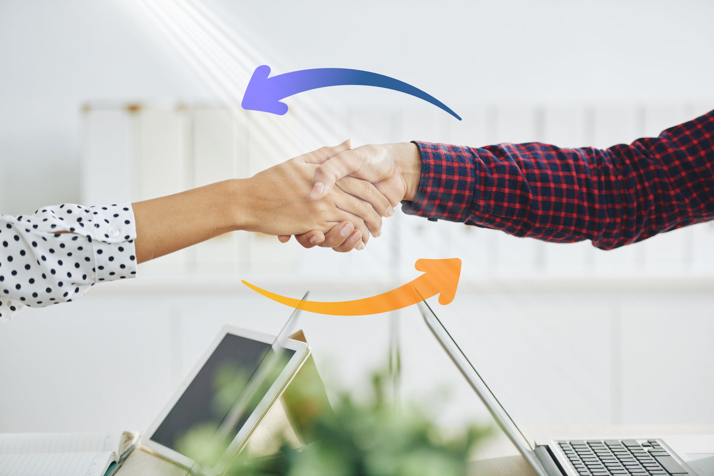 Sincerely Services Specialist shaking hands with client as Sincerely Services orange and purple arrows indicate teamwork